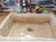 Rustic travertine stone kitchen sink with a trough