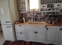 Rustic travertine stone kitchen sink with a trough
